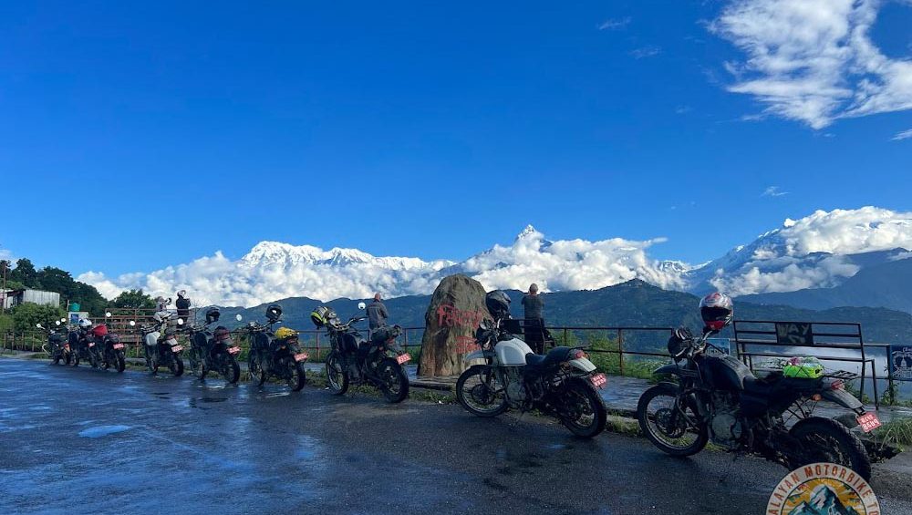 Royal Enfield riders crossing Kali Gandaki Gorge during motorbike adventure in Mustang